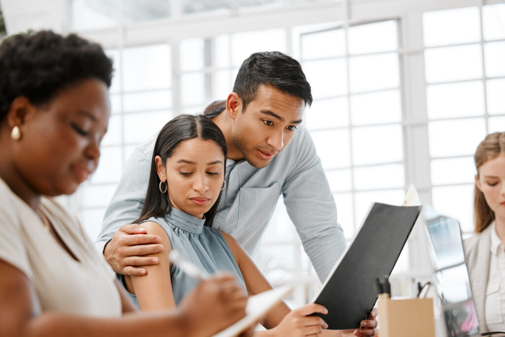 a man holding a woman's shoulder